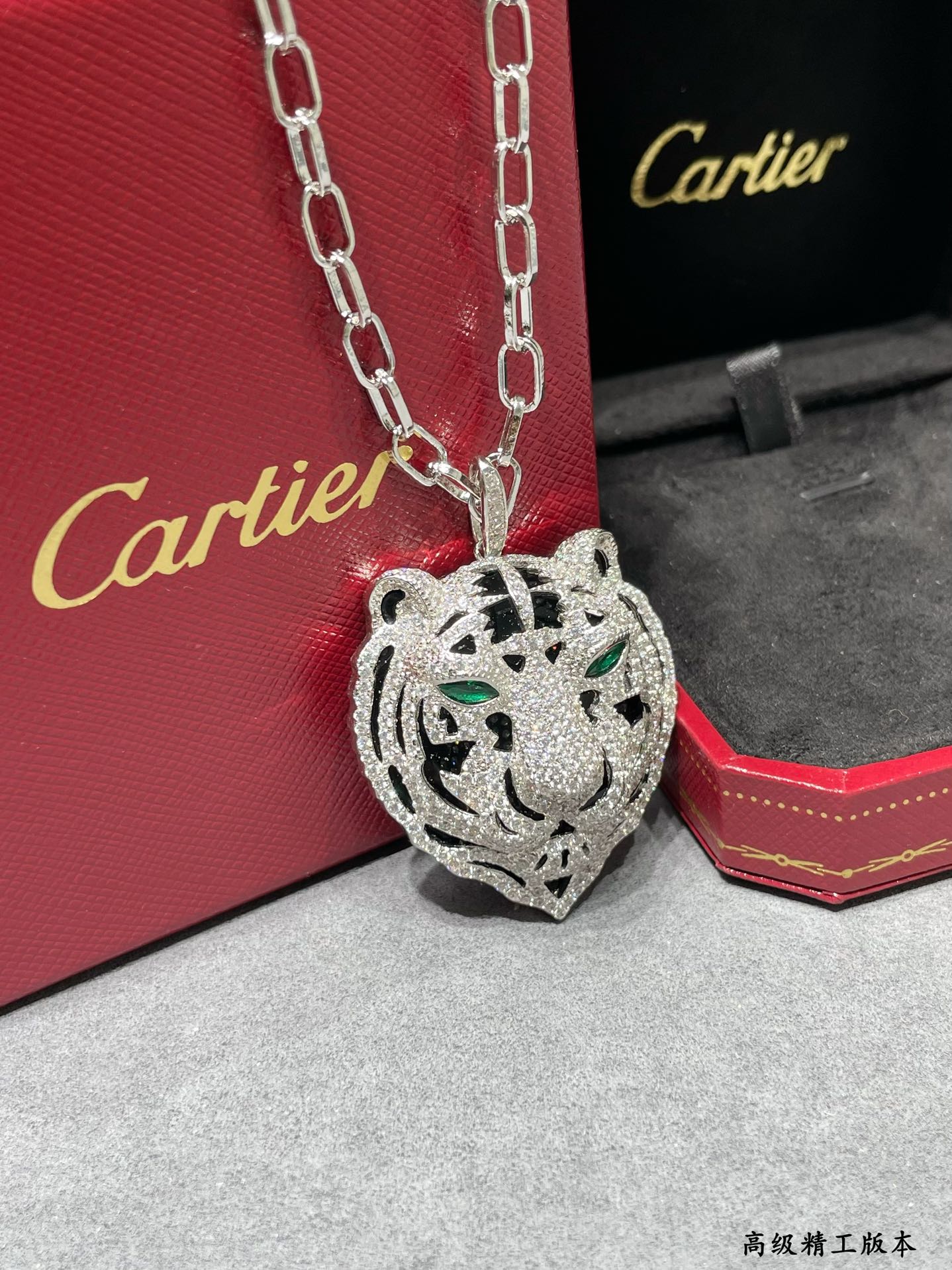 Cartier PANTHERE DE CARTIER Tiger Head Pendant necklace Silver-toned white gold set with white diamonds black onyx accents emerald green gemstone eyes black enamel reverse 80cm