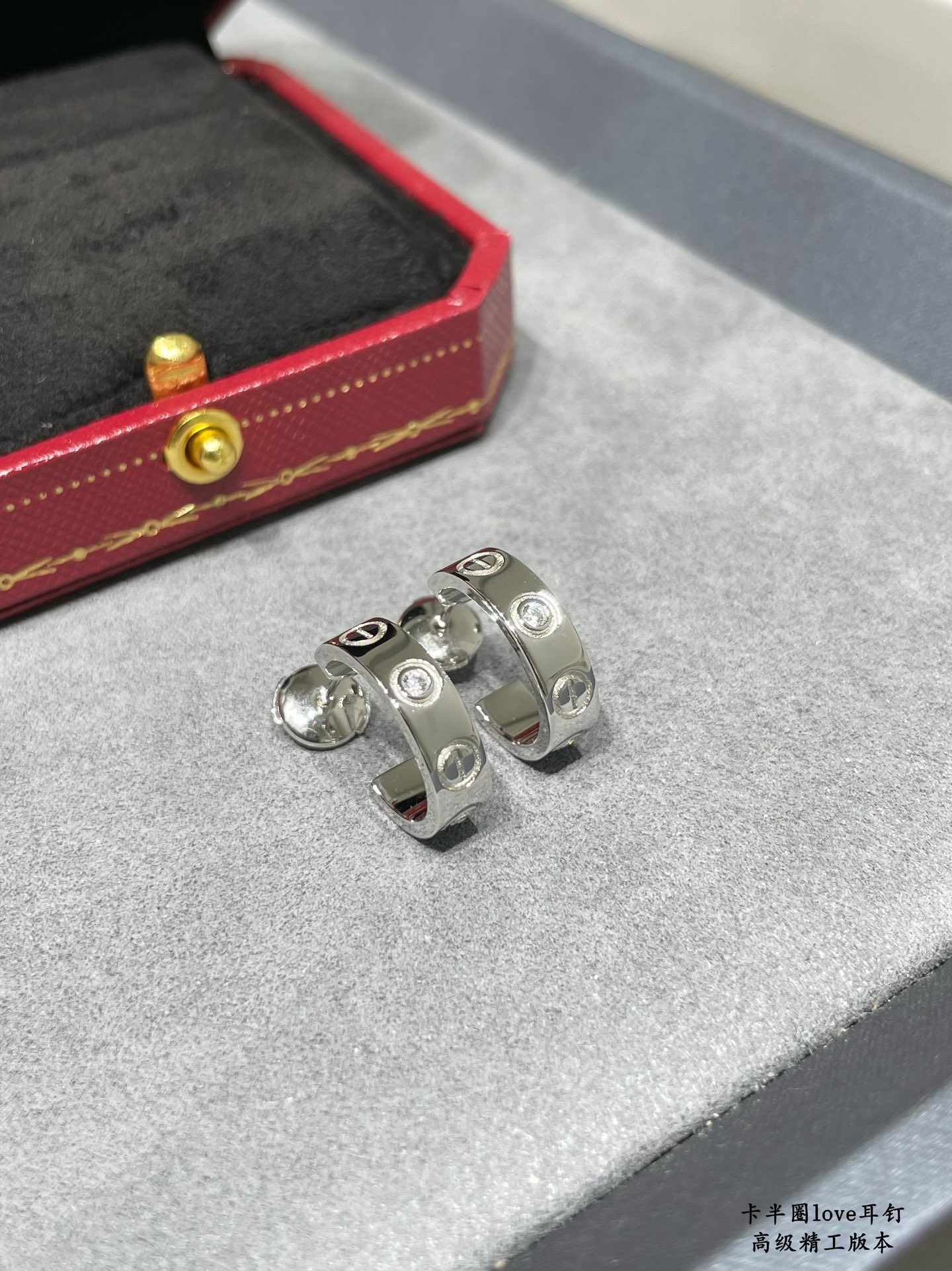 Cartier LOVE earrings 18k yellow gold 18k white gold with clear diamond accents 13mm outer diameter