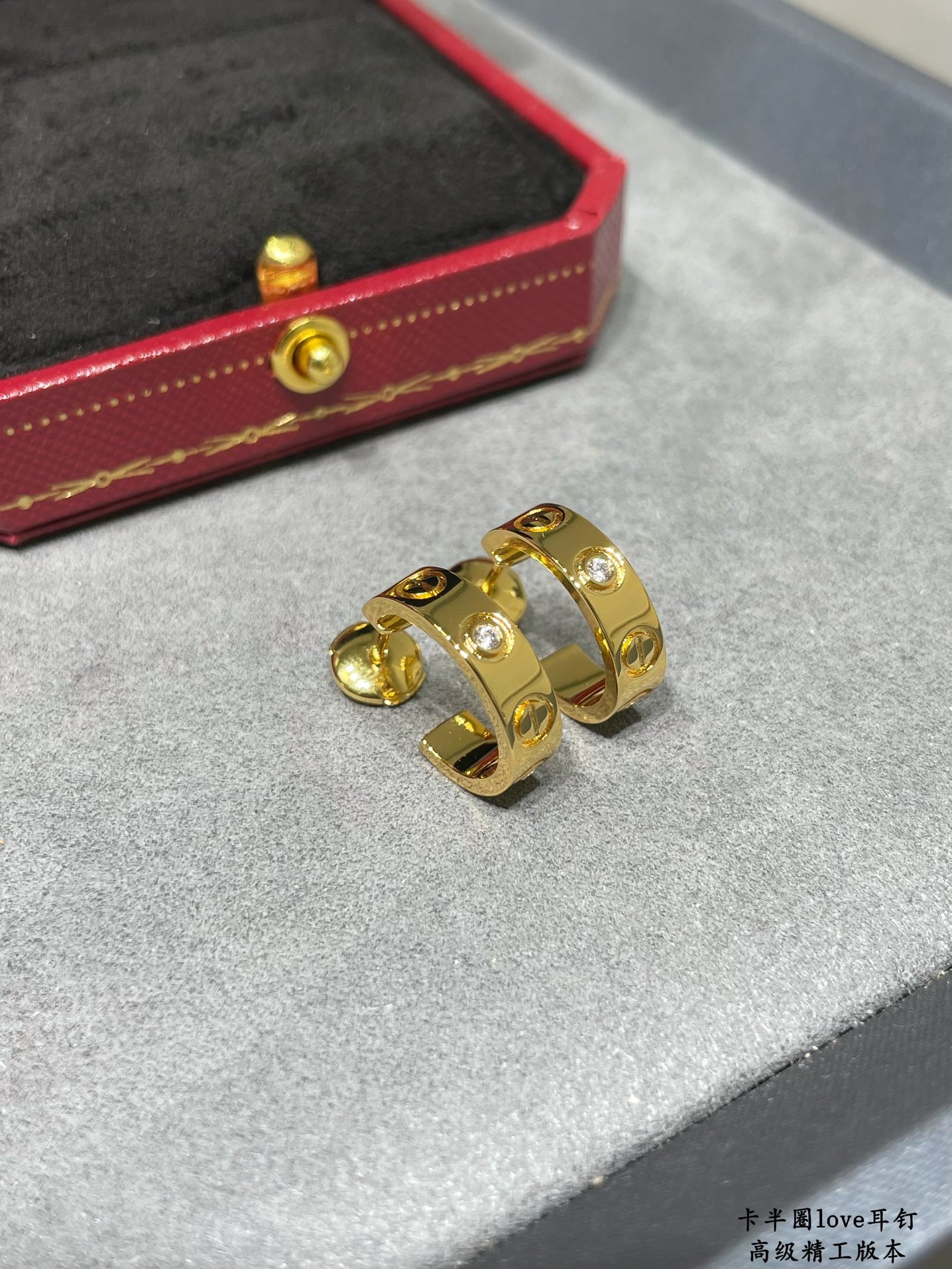 Cartier LOVE earrings 18k yellow gold 18k white gold with clear diamond accents 13mm outer diameter