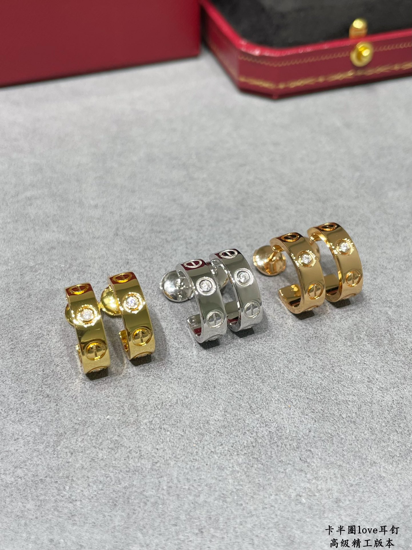 Cartier LOVE earrings 18k yellow gold 18k white gold with clear diamond accents 13mm outer diameter