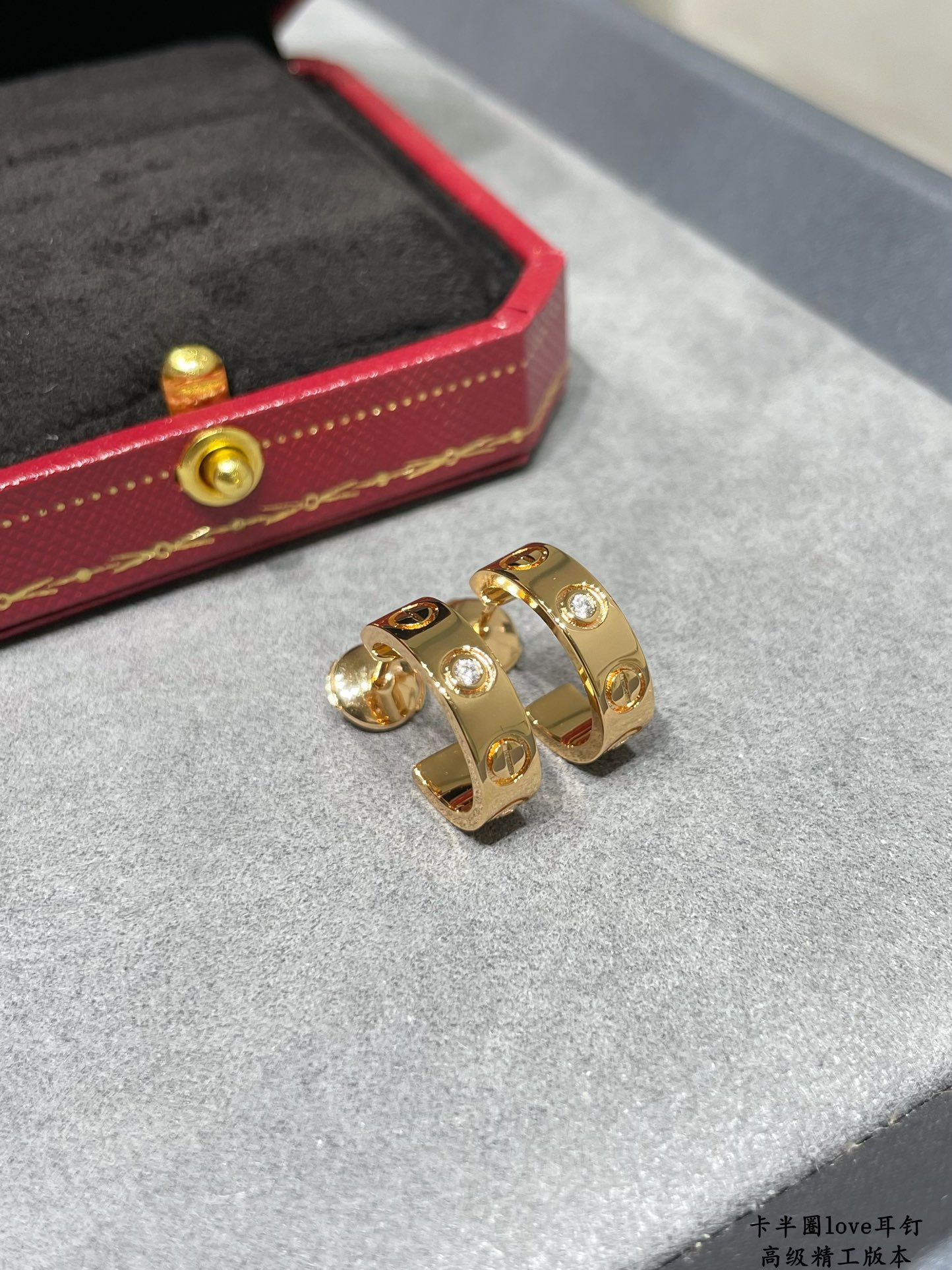 Cartier LOVE earrings 18k yellow gold 18k white gold with clear diamond accents 13mm outer diameter