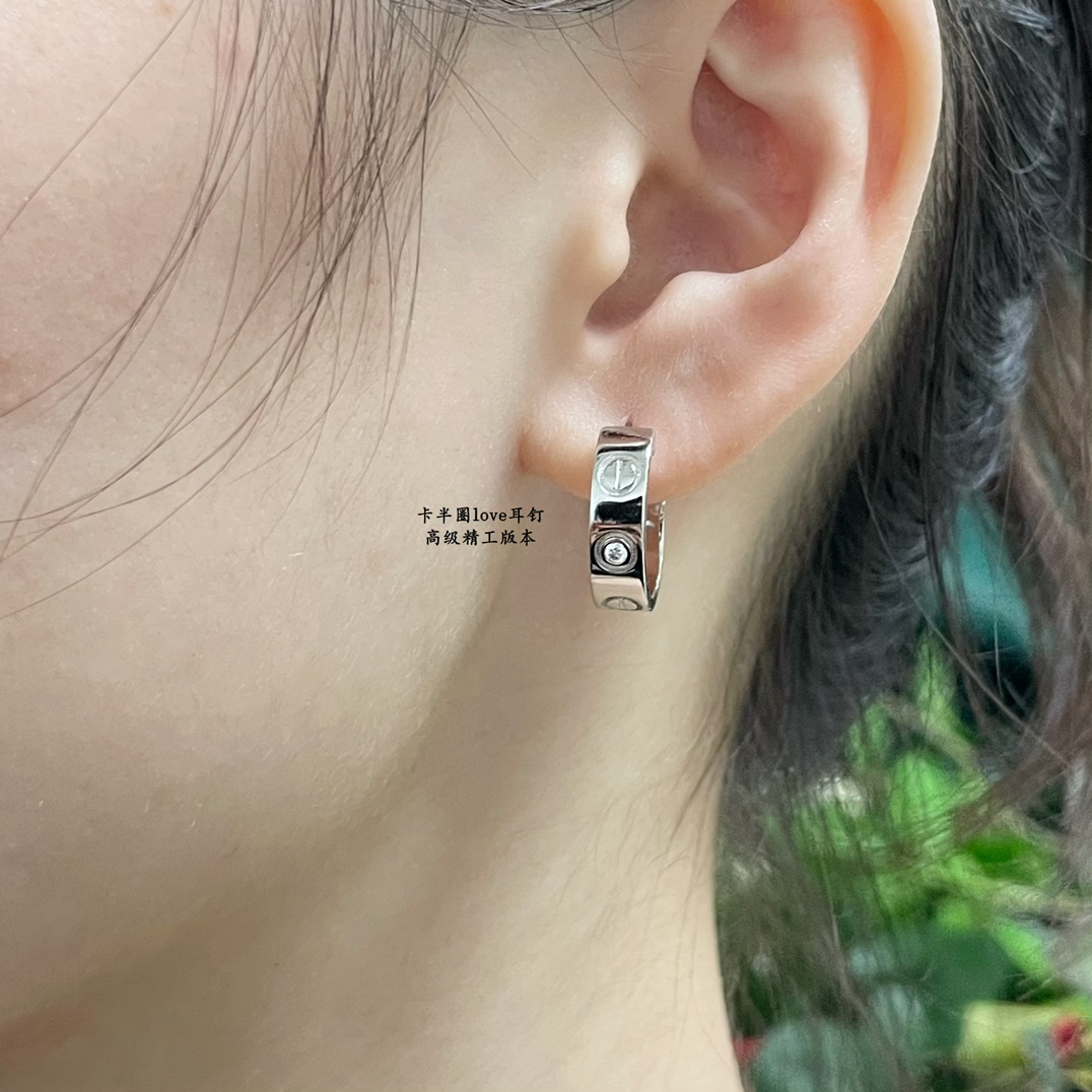 Cartier LOVE earrings 18k yellow gold 18k white gold with clear diamond accents 13mm outer diameter
