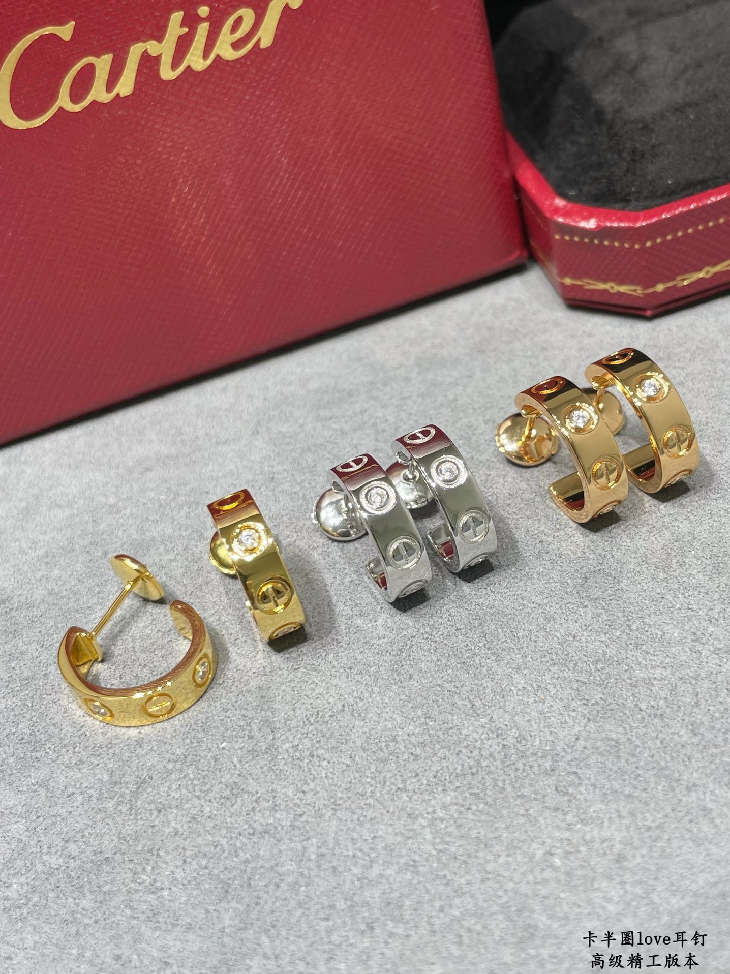 Cartier LOVE earrings 18k yellow gold 18k white gold with clear diamond accents 13mm outer diameter