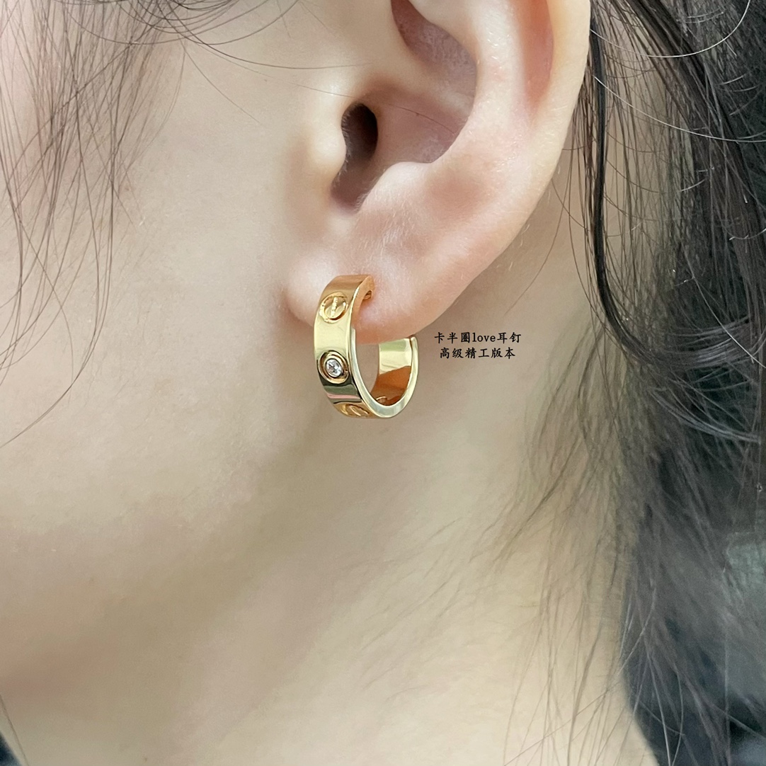 Cartier LOVE earrings 18k yellow gold 18k white gold with clear diamond accents 13mm outer diameter