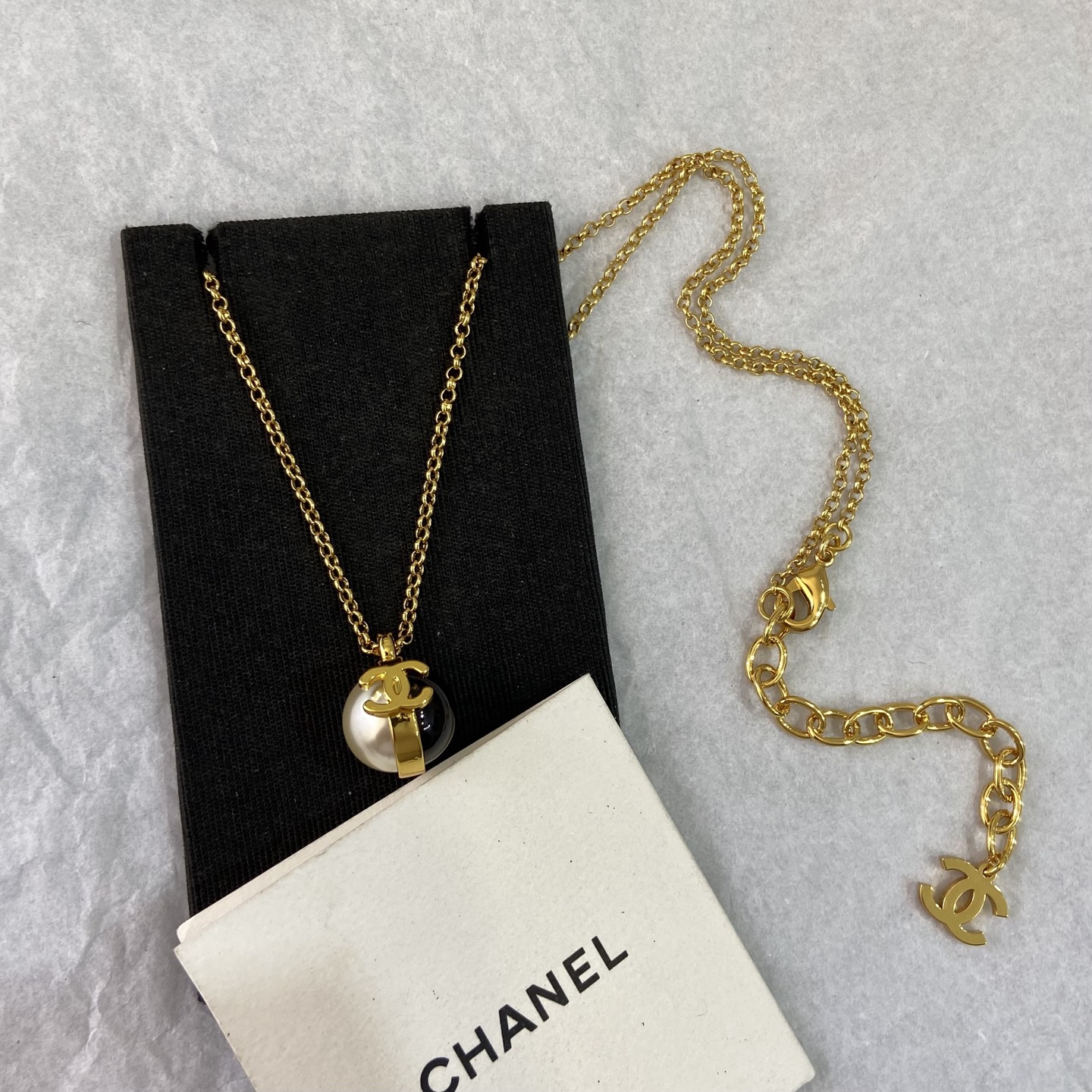 Chanel CC Logo Pearl Resin Ball Pendant Necklace necklace gold tone metal white faux pearl black resin 42cm with 5cm extender