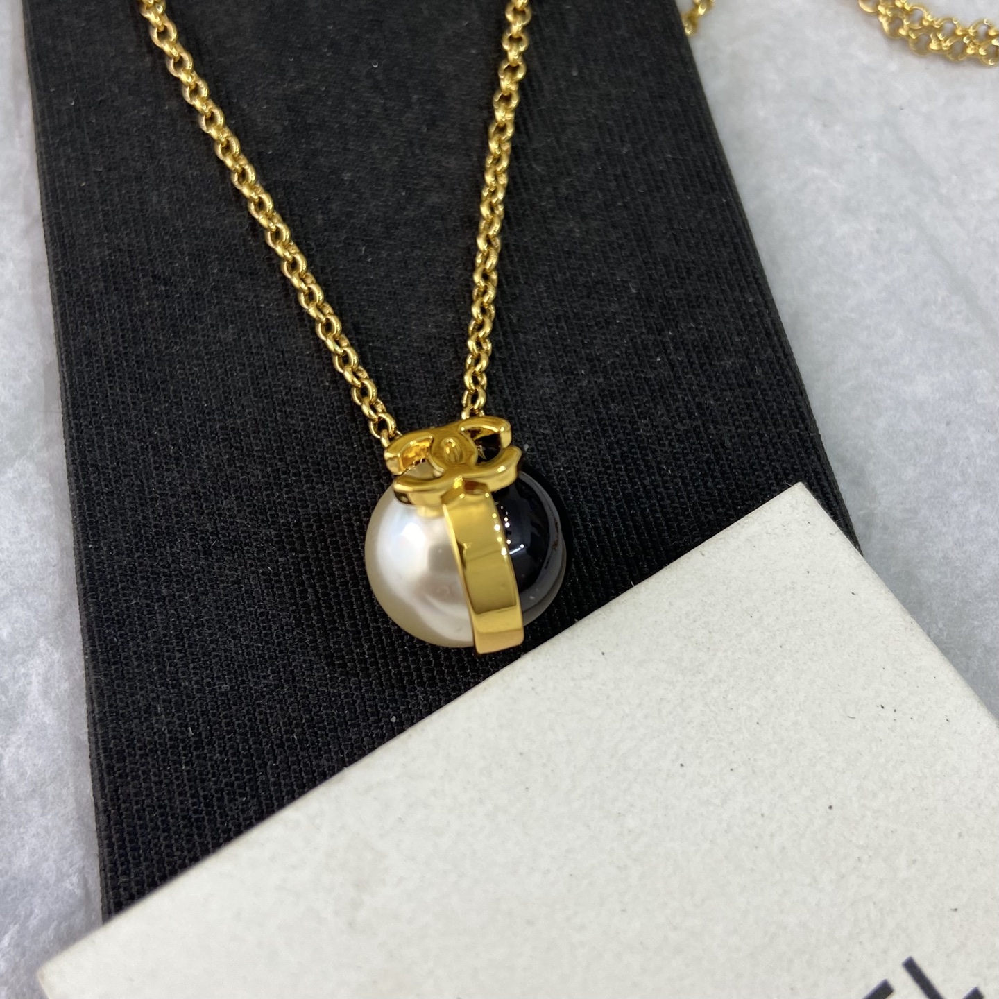 Chanel CC Logo Pearl Resin Ball Pendant Necklace necklace gold tone metal white faux pearl black resin 42cm with 5cm extender