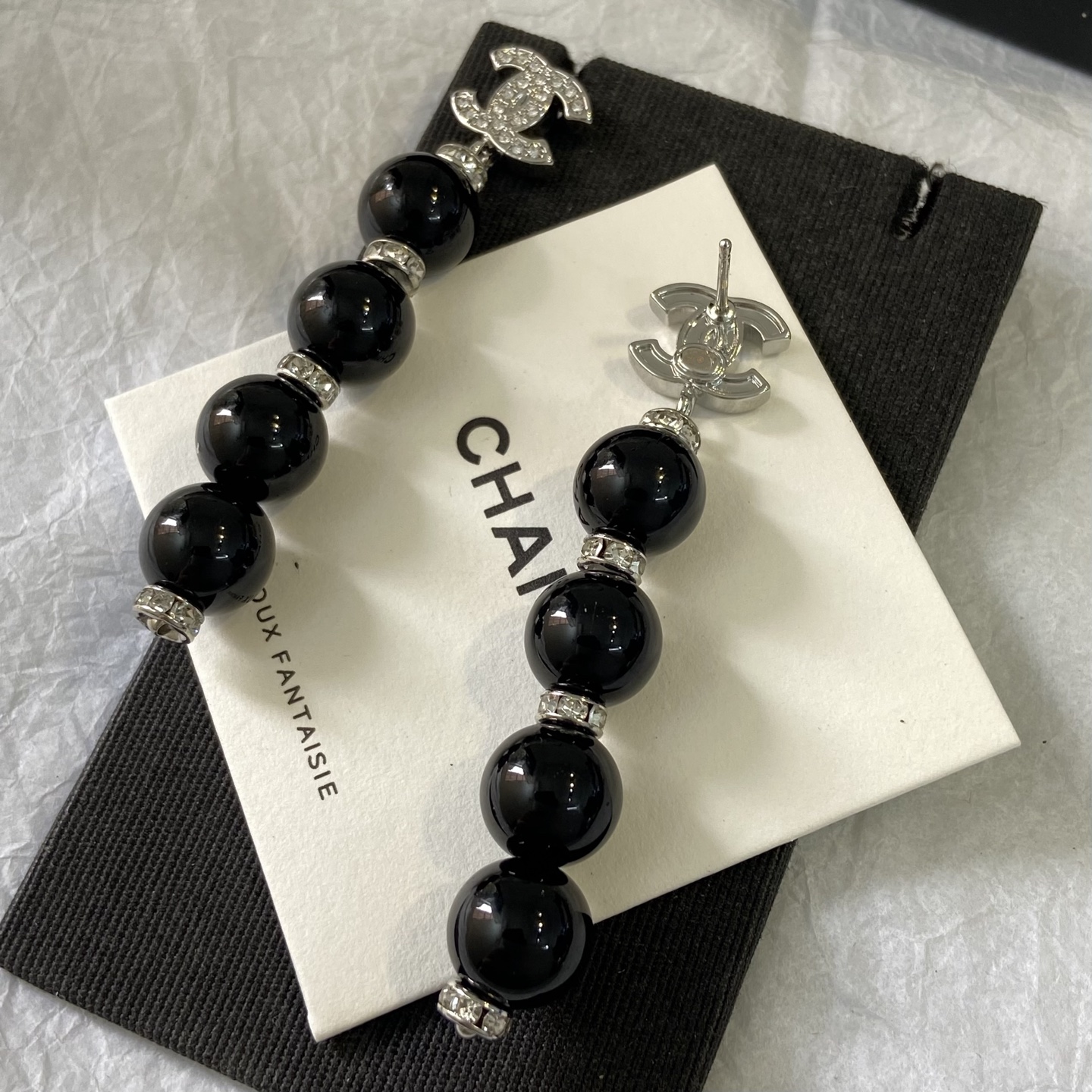 Chanel CC Logo Pearl Drop Earrings earrings Gold-tone metal with clear crystals and cream faux pearls Silver-tone metal with clear crystals and black resin beads 6 5cm length