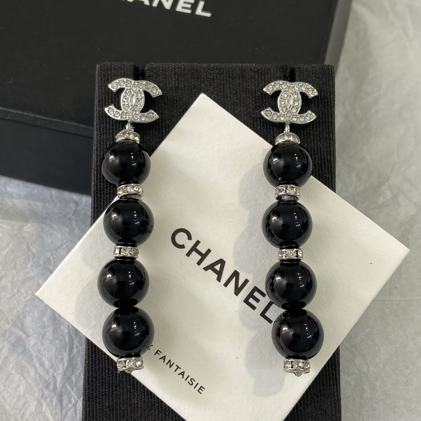 Chanel CC Logo Pearl Drop Earrings earrings Gold-tone metal with clear crystals and cream faux pearls Silver-tone metal with clear crystals and black resin beads 6 5cm length