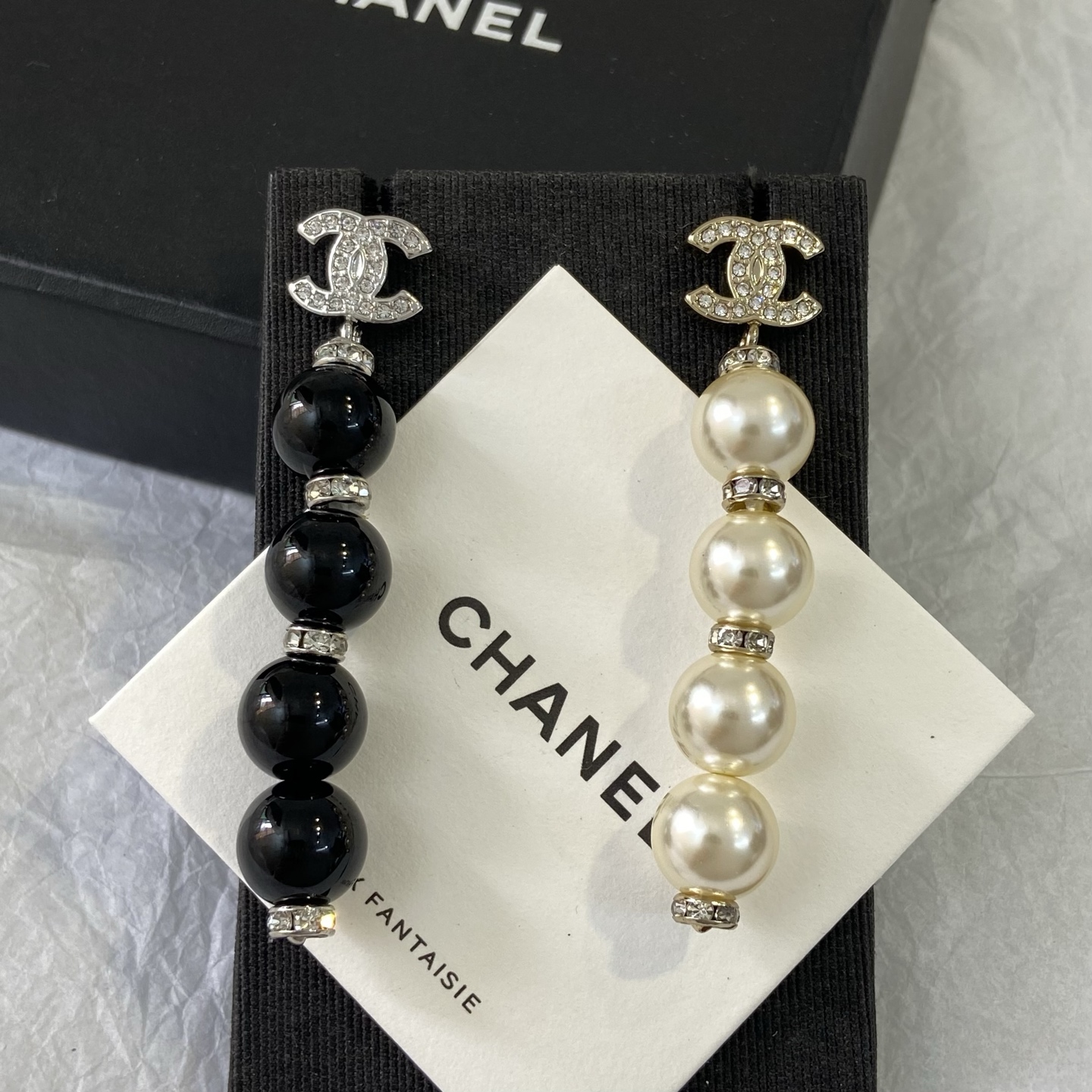 Chanel CC Logo Pearl Drop Earrings earrings Gold-tone metal with clear crystals and cream faux pearls Silver-tone metal with clear crystals and black resin beads 6 5cm length