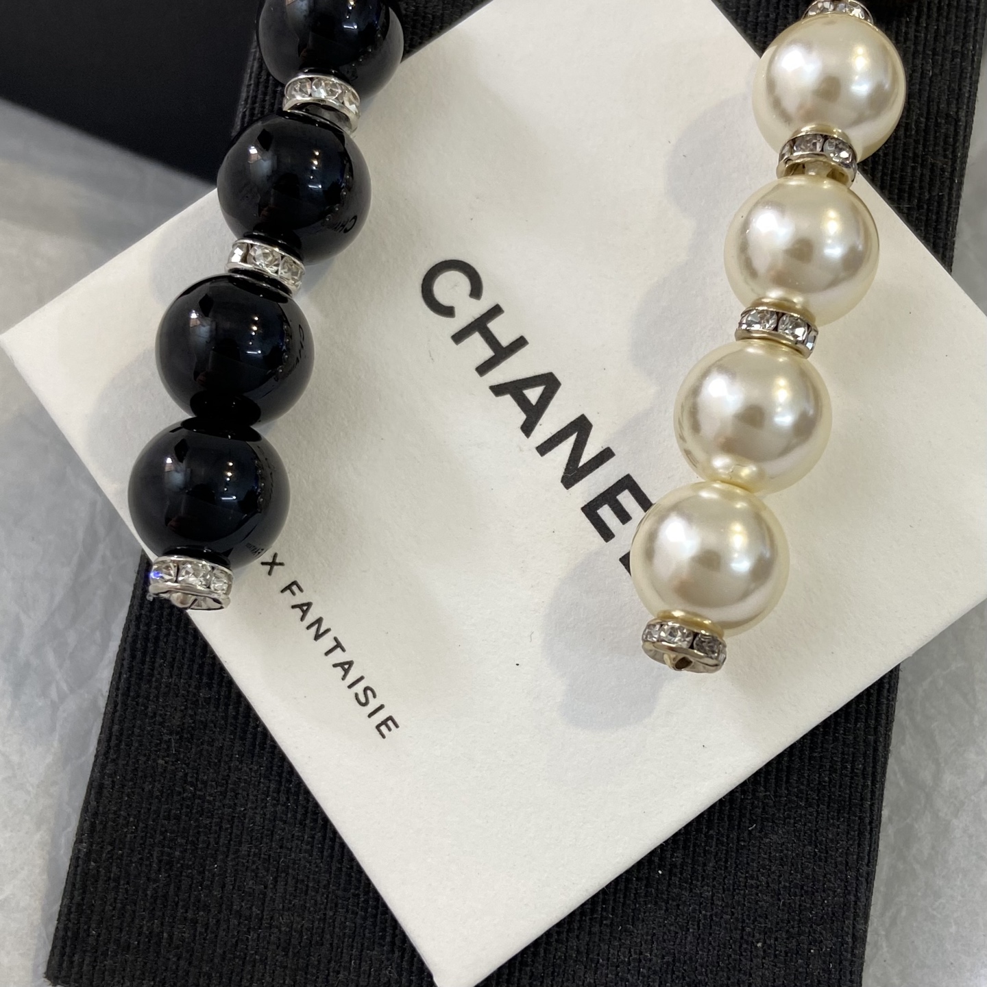 Chanel CC Logo Pearl Drop Earrings earrings Gold-tone metal with clear crystals and cream faux pearls Silver-tone metal with clear crystals and black resin beads 6 5cm length
