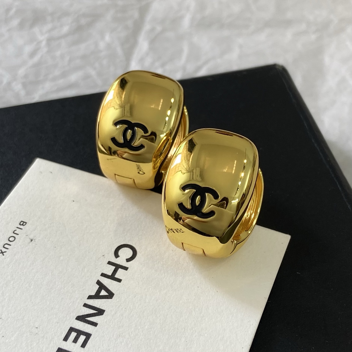 Chanel CC Logo Dome Clip-On Earrings earrings Polished gold-tone metal with black enamel CC logo One Size