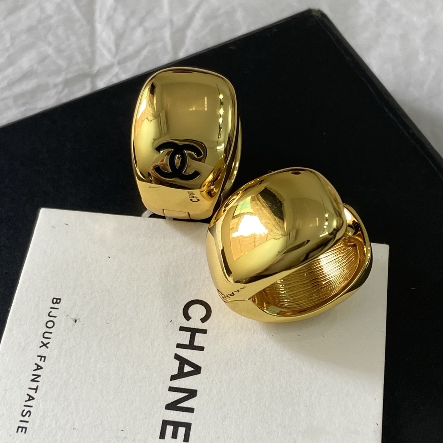Chanel CC Logo Dome Clip-On Earrings earrings Polished gold-tone metal with black enamel CC logo One Size