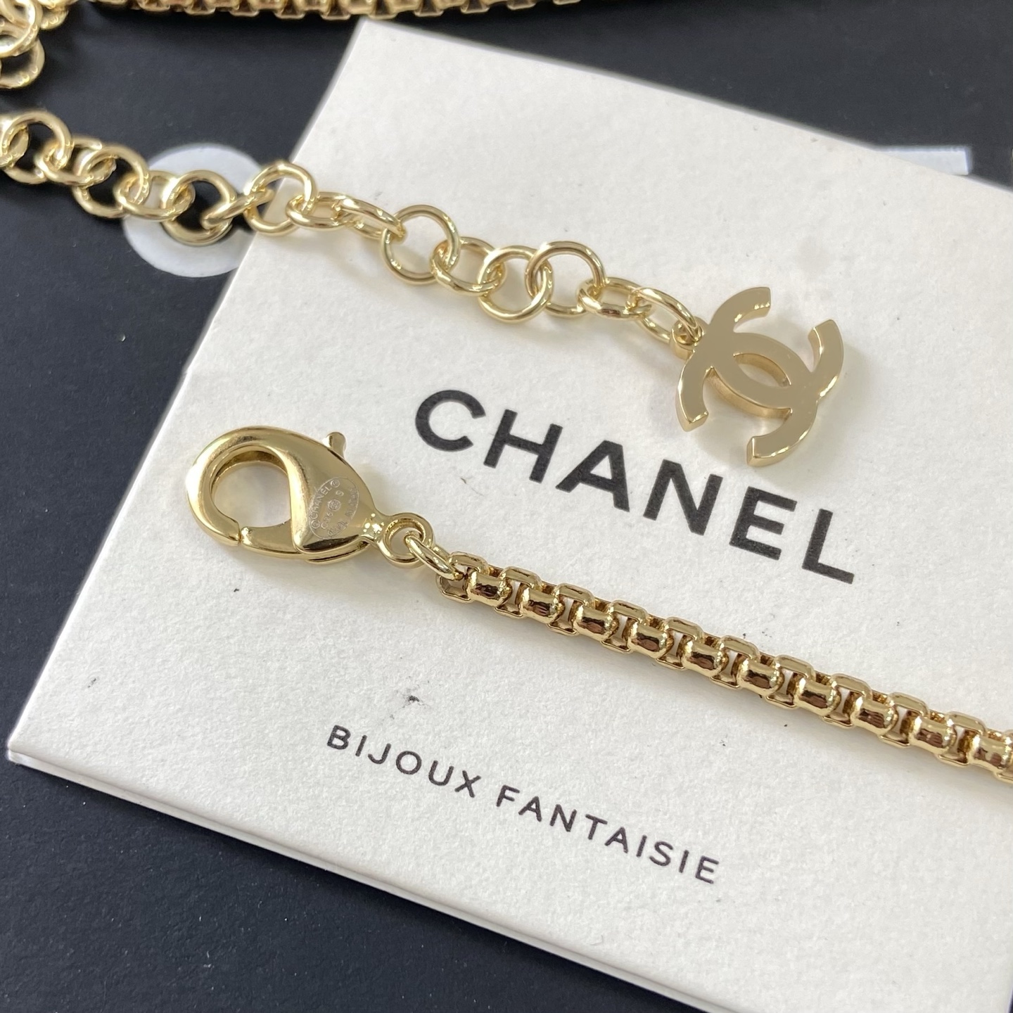 Chanel CC Logo Beach Vacation Charms Collection necklace Gold-tone metal with white faux pearls pink enamel light green enamel clear crystal accents and cream pearl cabochon 42cm with 5cm extender chain