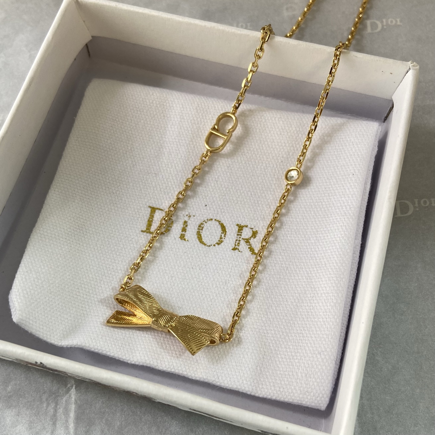 Dior Bow CD Logo Necklace necklace gold-tone metal with clear crystal accent 42cm with 5cm extender