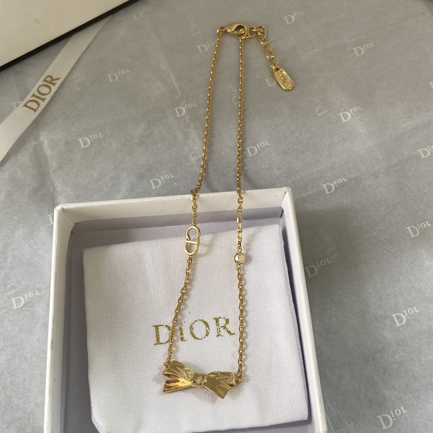 Dior Bow CD Logo Necklace necklace gold-tone metal with clear crystal accent 42cm with 5cm extender