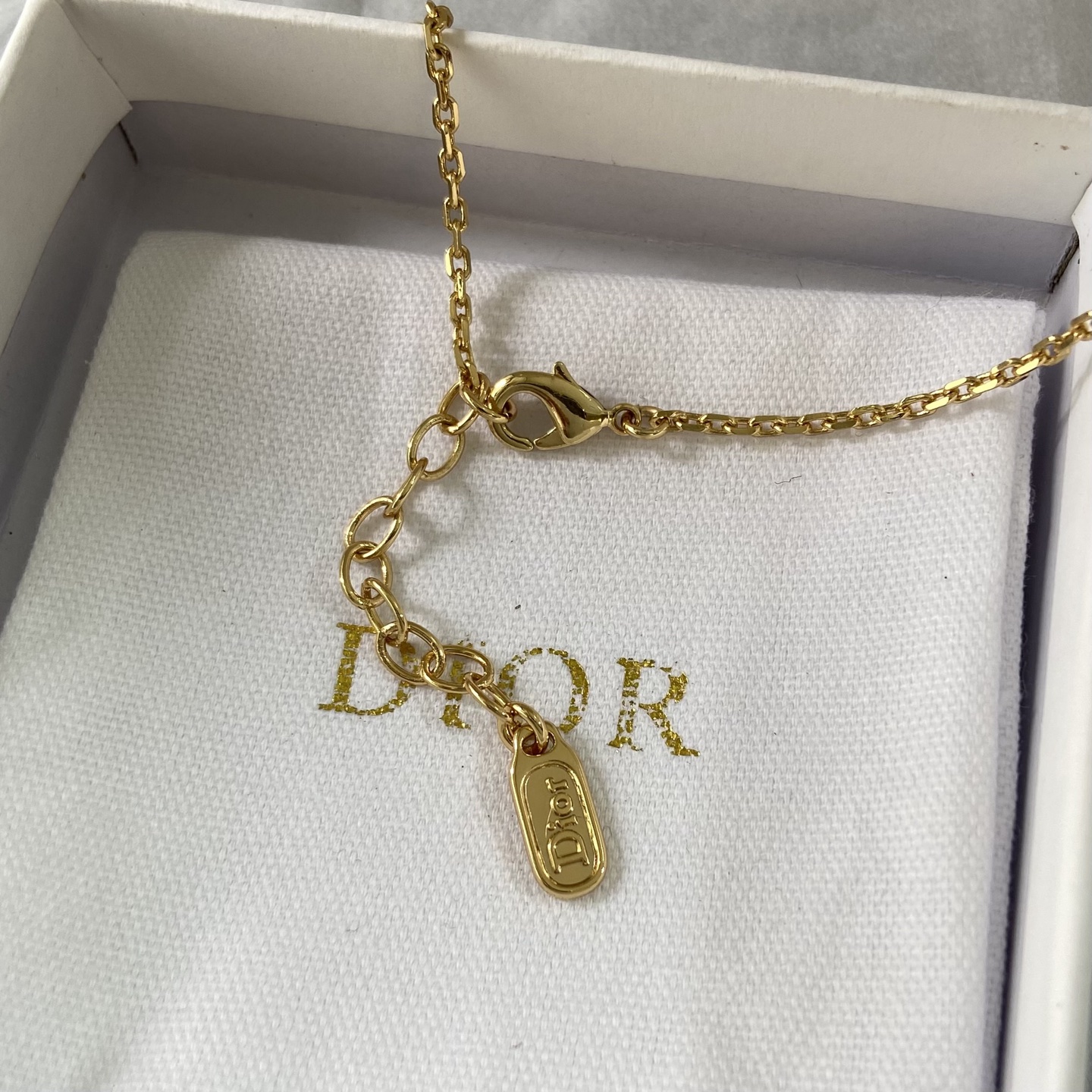 Dior Bow CD Logo Necklace necklace gold-tone metal with clear crystal accent 42cm with 5cm extender