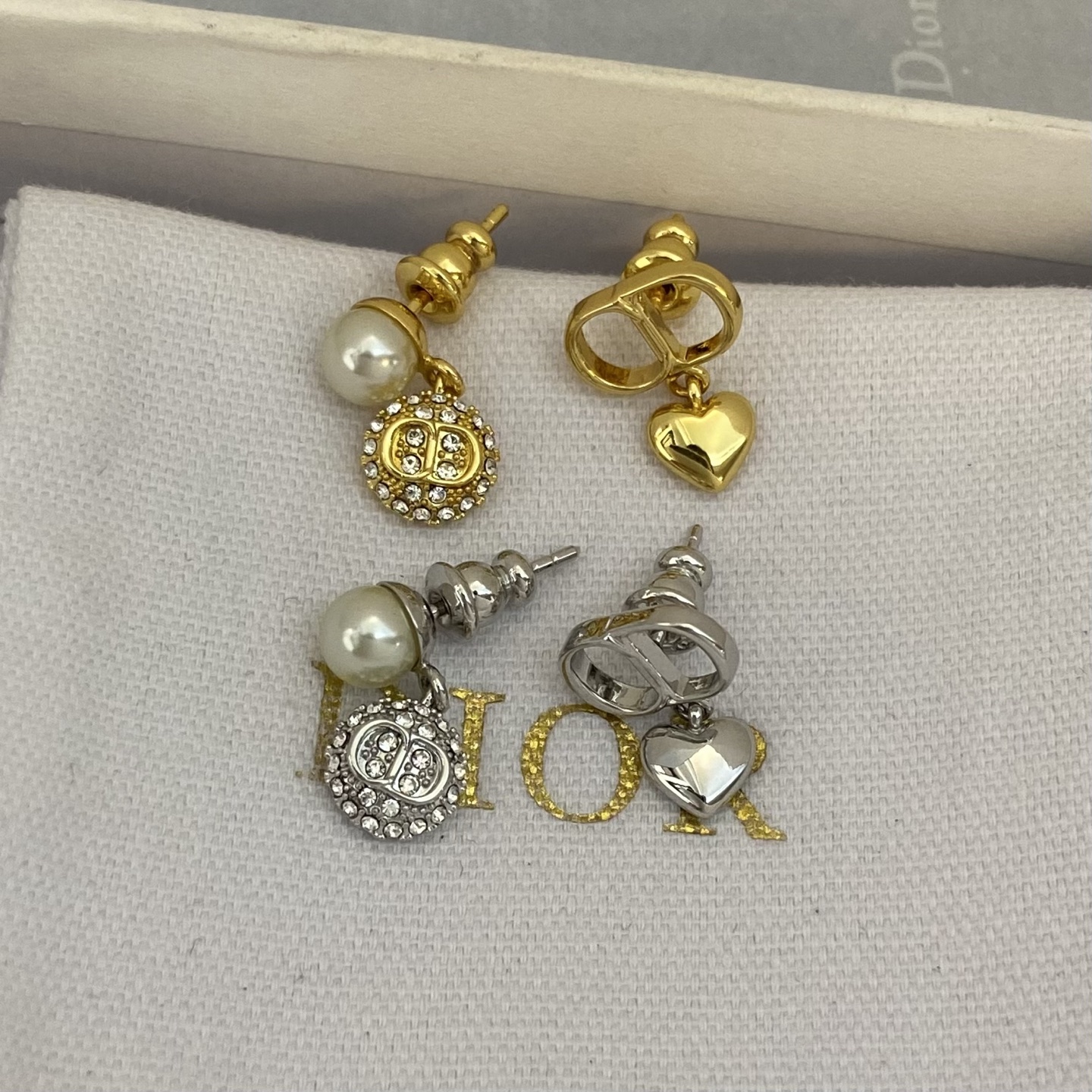 Dior CD Logo Mismatched Drop Earrings earrings Gold-tone metal with white faux pearl and clear crystal accents 1 5cm drop length