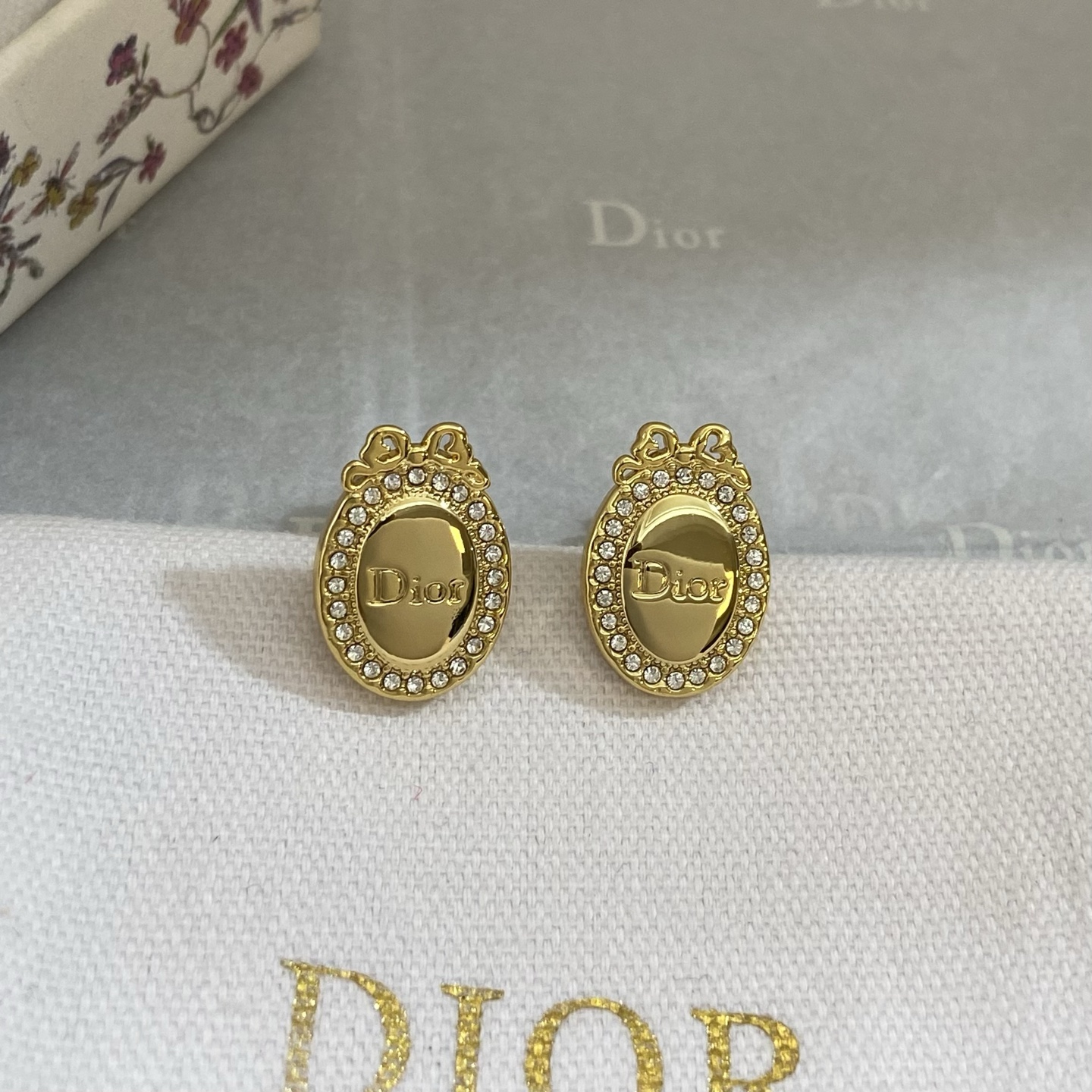 Dior Oval Logo Bow Crystal Stud Earrings earrings gold-tone metal with clear crystal accents 1 5cm length
