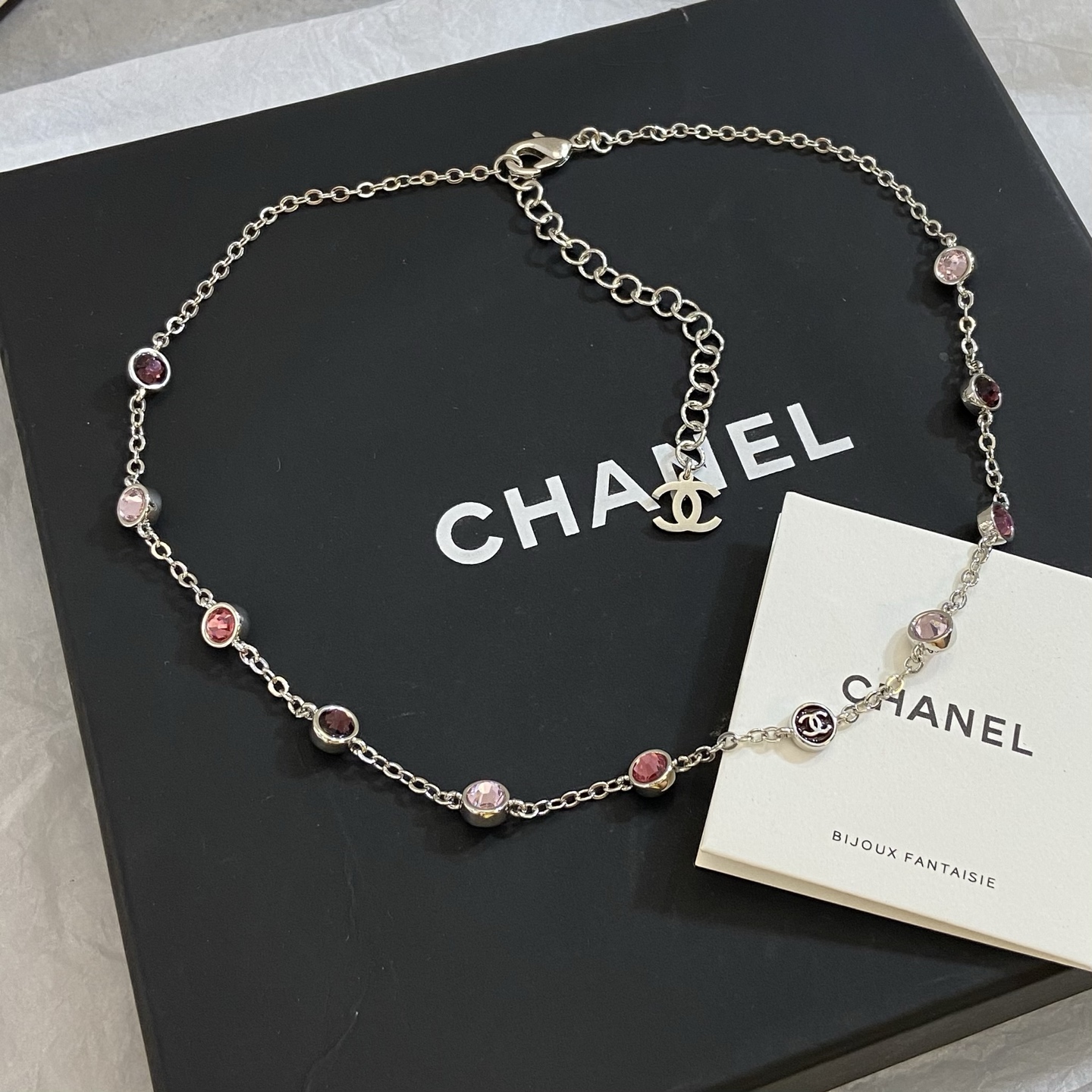Chanel CC Logo Multicolor Crystal Station Necklace necklace Silver-toned metal with light pink fuchsia pink and burgundy crystal accents light gold-tone CC charm 42cm with 5cm extender