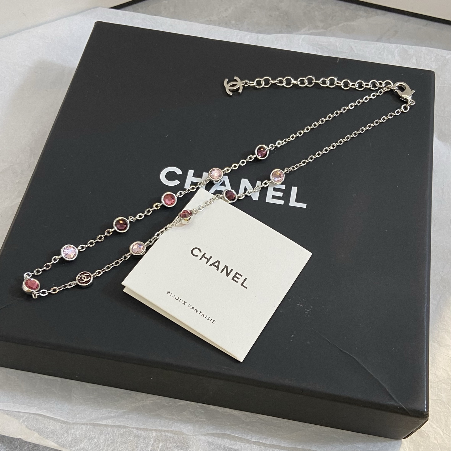 Chanel CC Logo Multicolor Crystal Station Necklace necklace Silver-toned metal with light pink fuchsia pink and burgundy crystal accents light gold-tone CC charm 42cm with 5cm extender