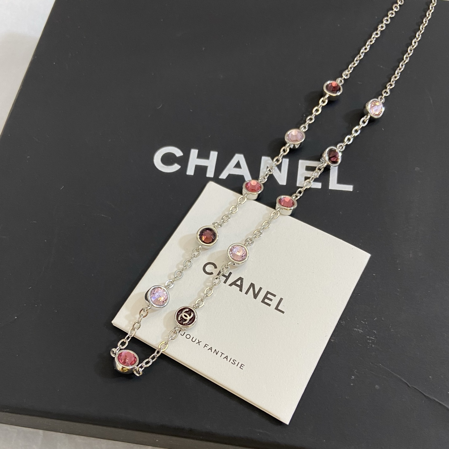 Chanel CC Logo Multicolor Crystal Station Necklace necklace Silver-toned metal with light pink fuchsia pink and burgundy crystal accents light gold-tone CC charm 42cm with 5cm extender
