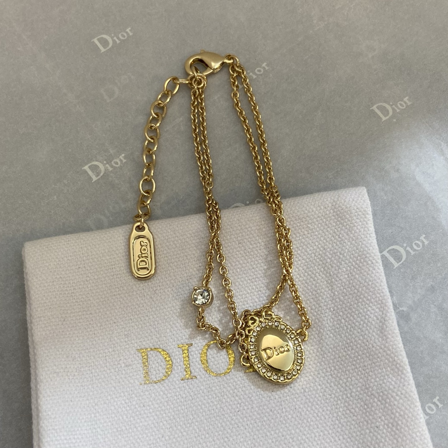 Dior Oval Logo Crystal Double Chain bracelet gold-tone metal with clear crystal accents 16cm with 3cm extender