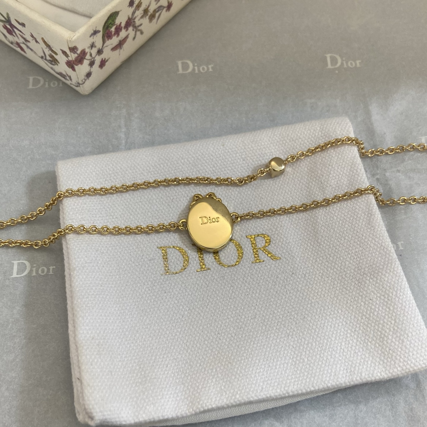 Dior Oval Logo Crystal Double Chain bracelet gold-tone metal with clear crystal accents 16cm with 3cm extender