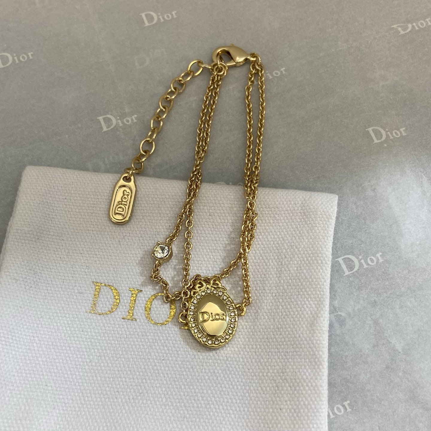 Dior Oval Logo Crystal Double Chain bracelet gold-tone metal with clear crystal accents 16cm with 3cm extender