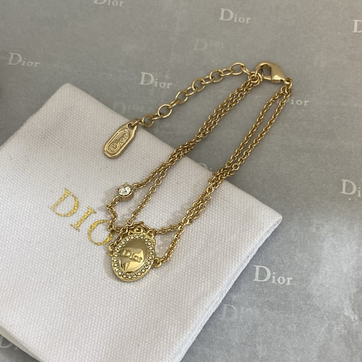 Dior Oval Logo Crystal Double Chain bracelet gold-tone metal with clear crystal accents 16cm with 3cm extender