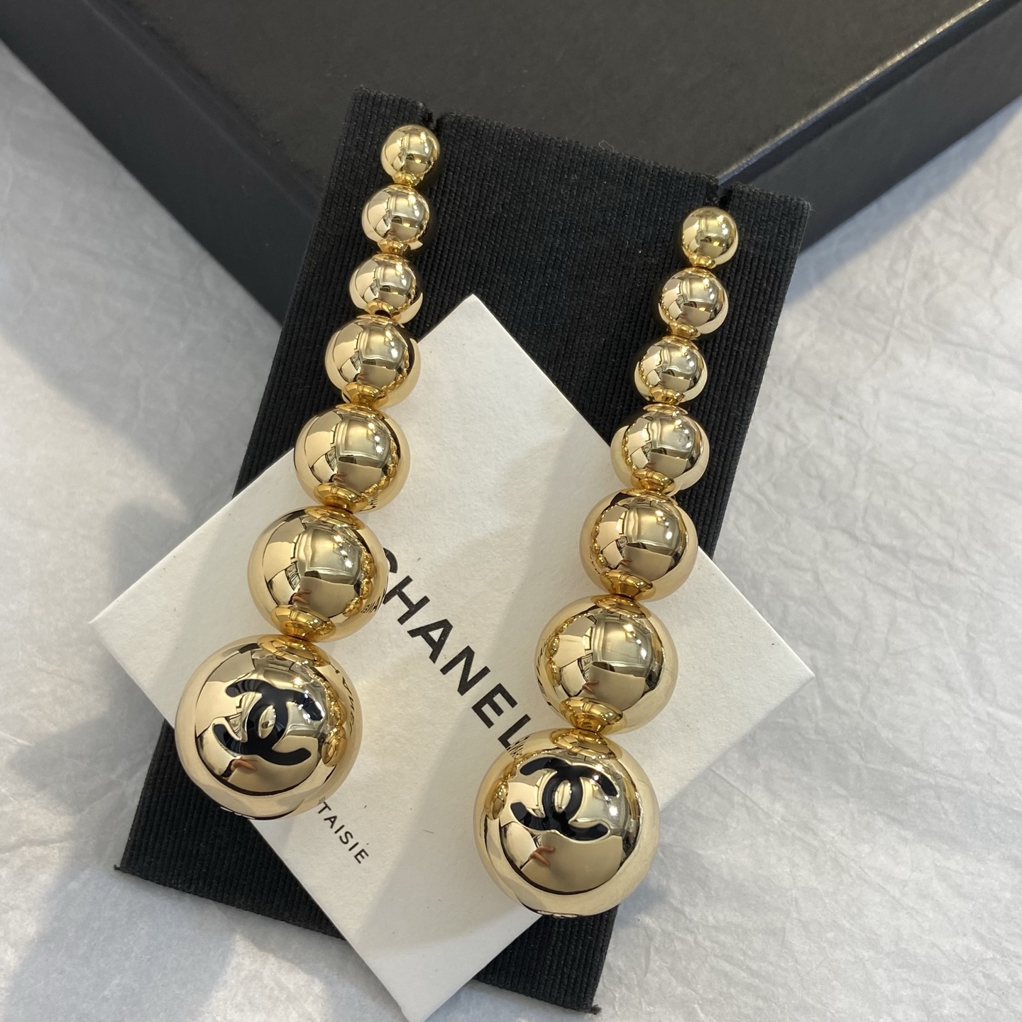 Chanel CC Graduated Bead Drop Earrings earrings gold-tone metal with black enamel CC logo 7cm drop length