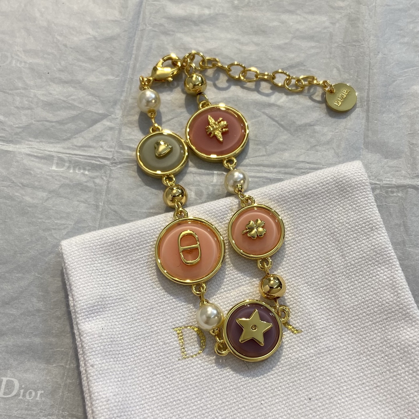 Dior Colorful Small Circle Lucky Charm Bracelet bracelet Gold-tone metal with white faux pearls multicolor enamel sage green dusty rose peach plum and gold-tone charms heart bee CD logo clover star 18cm with 5cm extension chain