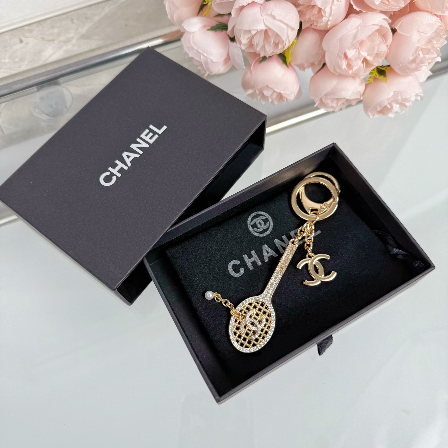 Chanel CC Tennis Racket Bag Charm Keychain pendant Gold-tone metal with clear crystals and white faux pearl Silver-tone metal with clear crystals and white faux pearl 10cm total length