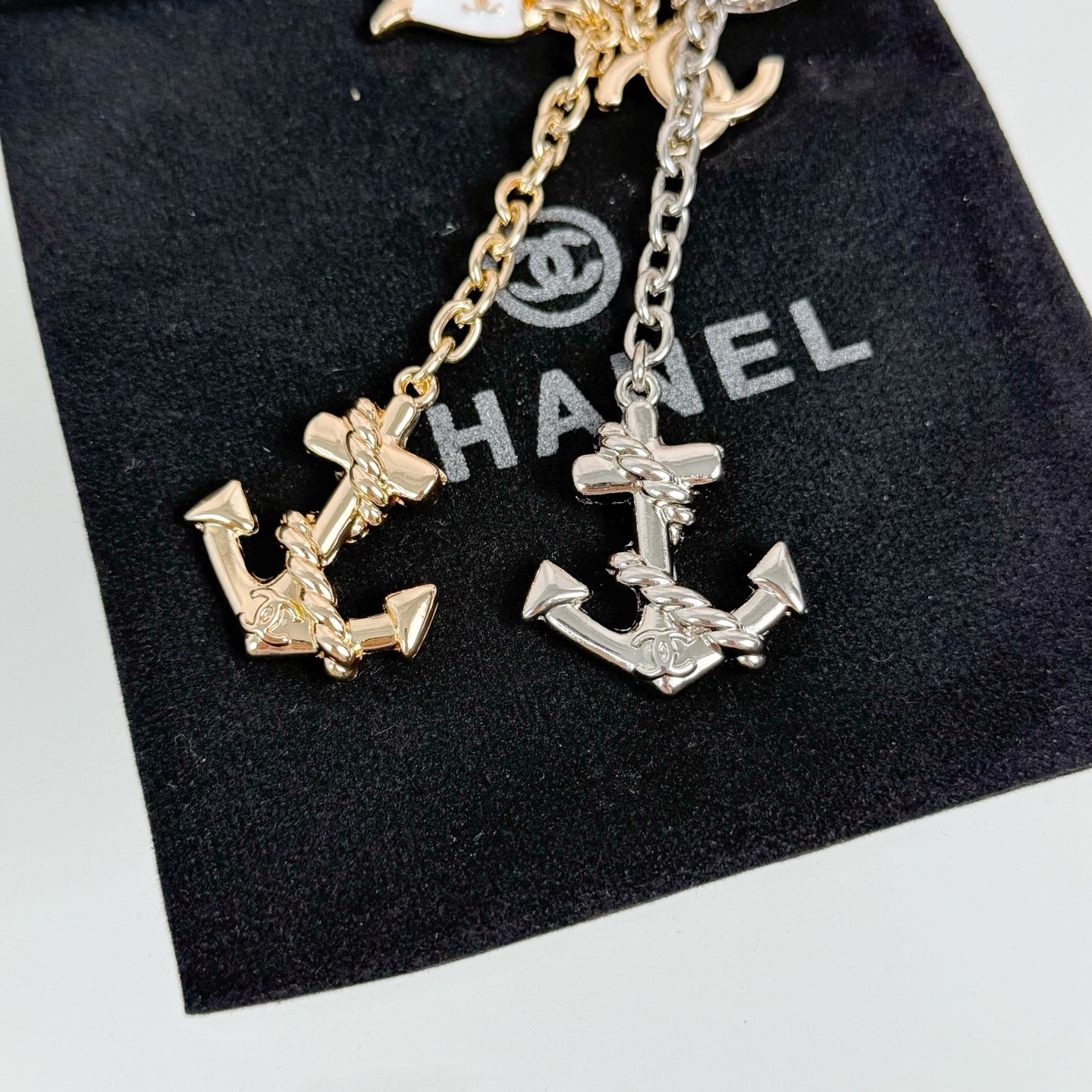 Chanel CC Nautical Anchor Fish Charm Key Holder pendant Gold-tone metal with white enamel fish charm Silver-tone metal with white enamel fish charm 10cm total drop length