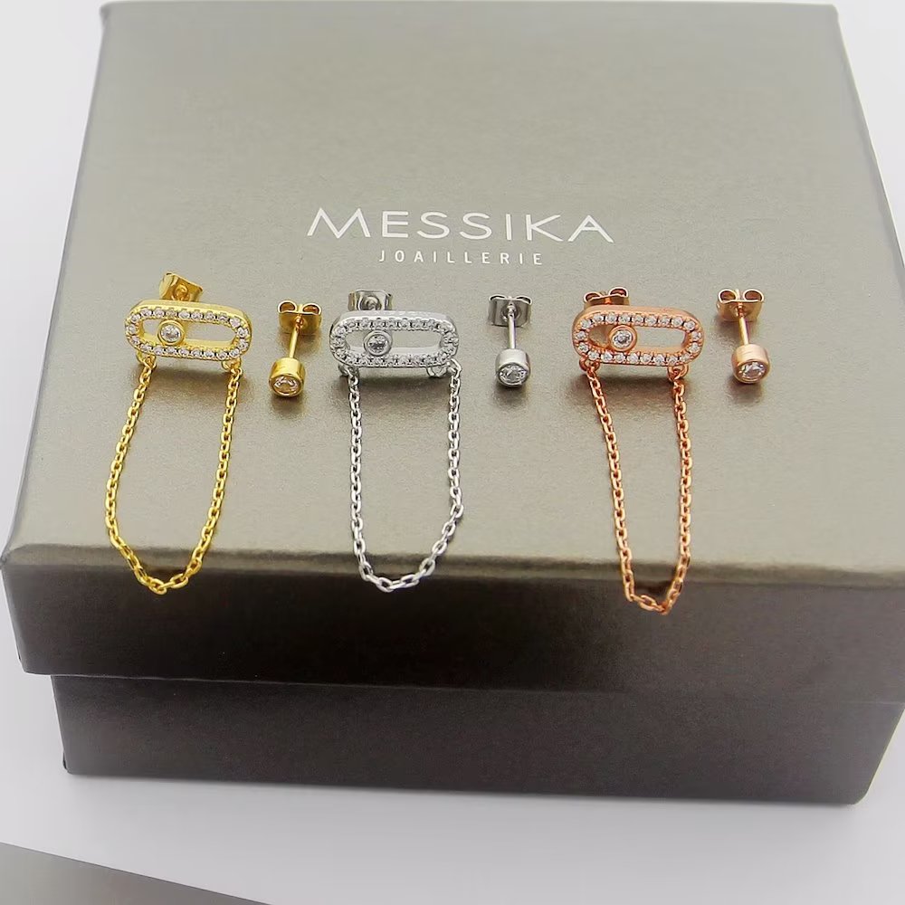 Messika Move Uno earrings Available in 18k yellow gold 18k white gold 18k rose gold set with colorless diamonds One size standard stud earring with 2cm drop chain