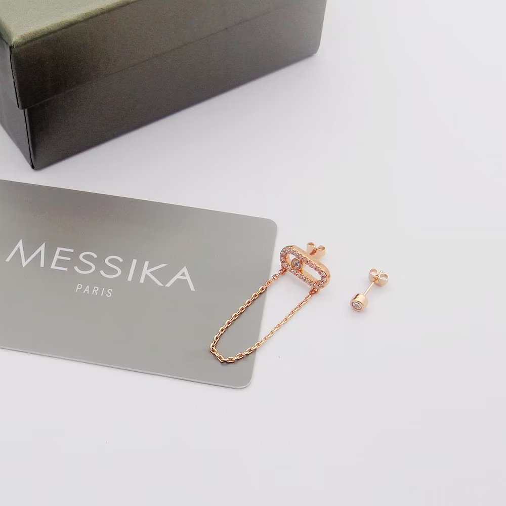 Messika Move Uno earrings Available in 18k yellow gold 18k white gold 18k rose gold set with colorless diamonds One size standard stud earring with 2cm drop chain