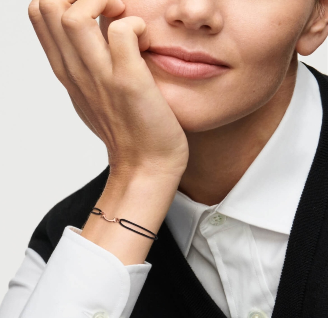 Tiffany Co T Smile bracelet available in yellow gold rose gold silver metal finishes with red black or Tiffany blue cord adjustable sliding knot cord fits 15-20cm wrist