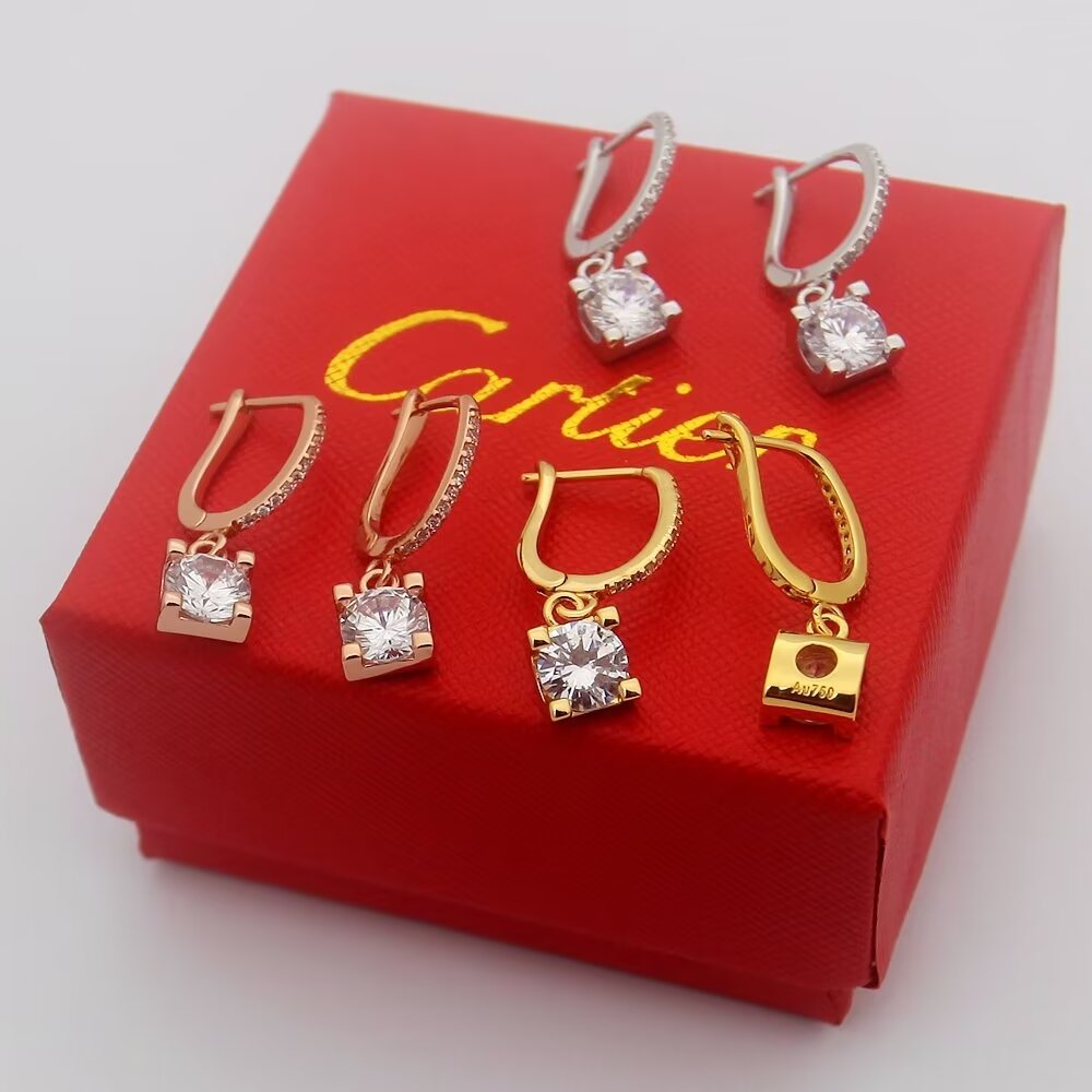 Cartier C de Cartier Diamond Drop Earrings earrings Yellow gold with clear round-cut diamond simulants red enamel accent available variants in rose gold and white gold with clear stones 15mm drop length