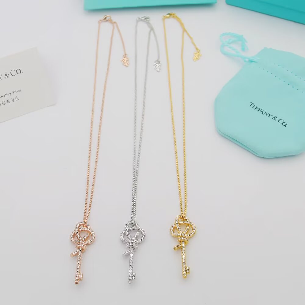 Tiffany Co Tiffany Keys Woven Knot Key Pendant necklace 18K rose gold with pave diamonds 16-18 inch adjustable chain