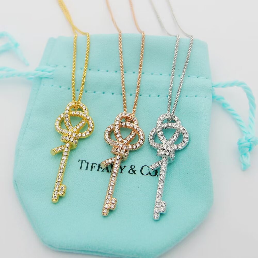 Tiffany Co Tiffany Keys Woven Knot Key Pendant necklace 18K rose gold with pave diamonds 16-18 inch adjustable chain