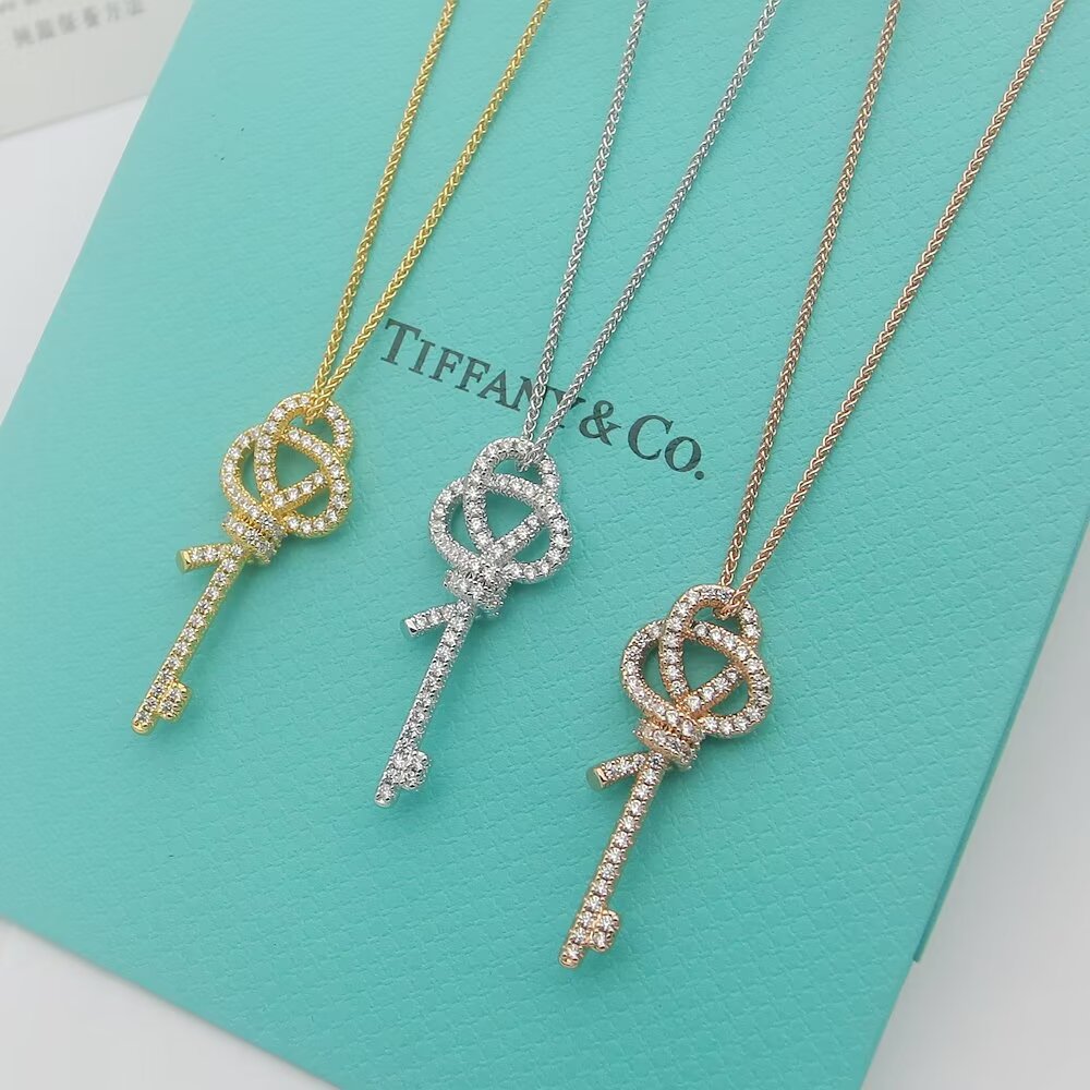 Tiffany Co Tiffany Keys Woven Knot Key Pendant necklace 18K rose gold with pave diamonds 16-18 inch adjustable chain