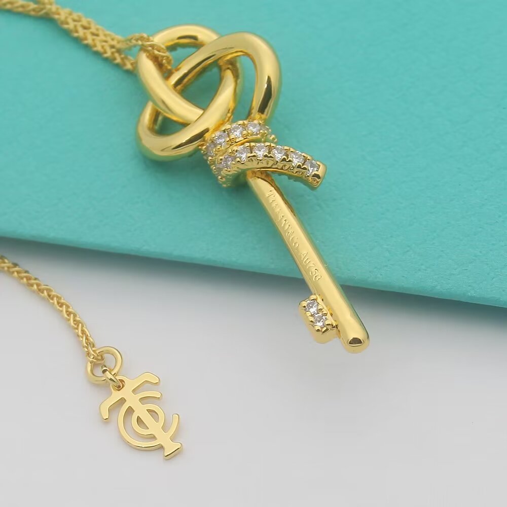 Tiffany Co Tiffany Keys Woven Knot Key Pendant necklace 18K rose gold with pave diamonds 16-18 inch adjustable chain