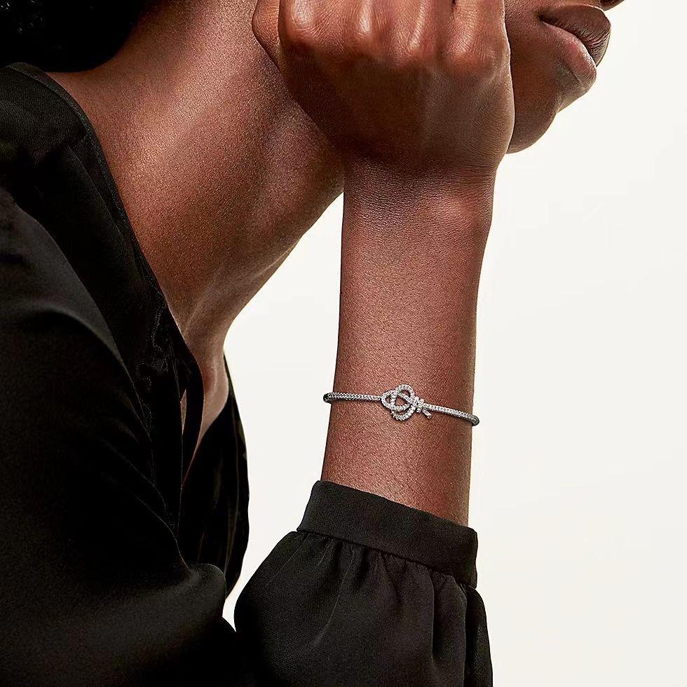 Tiffany Co Tiffany Keys Woven Key Hinged Bangle bracelet 18K yellow gold 18K rose gold 18K white gold with pave set clear diamonds 17cm inner circumference