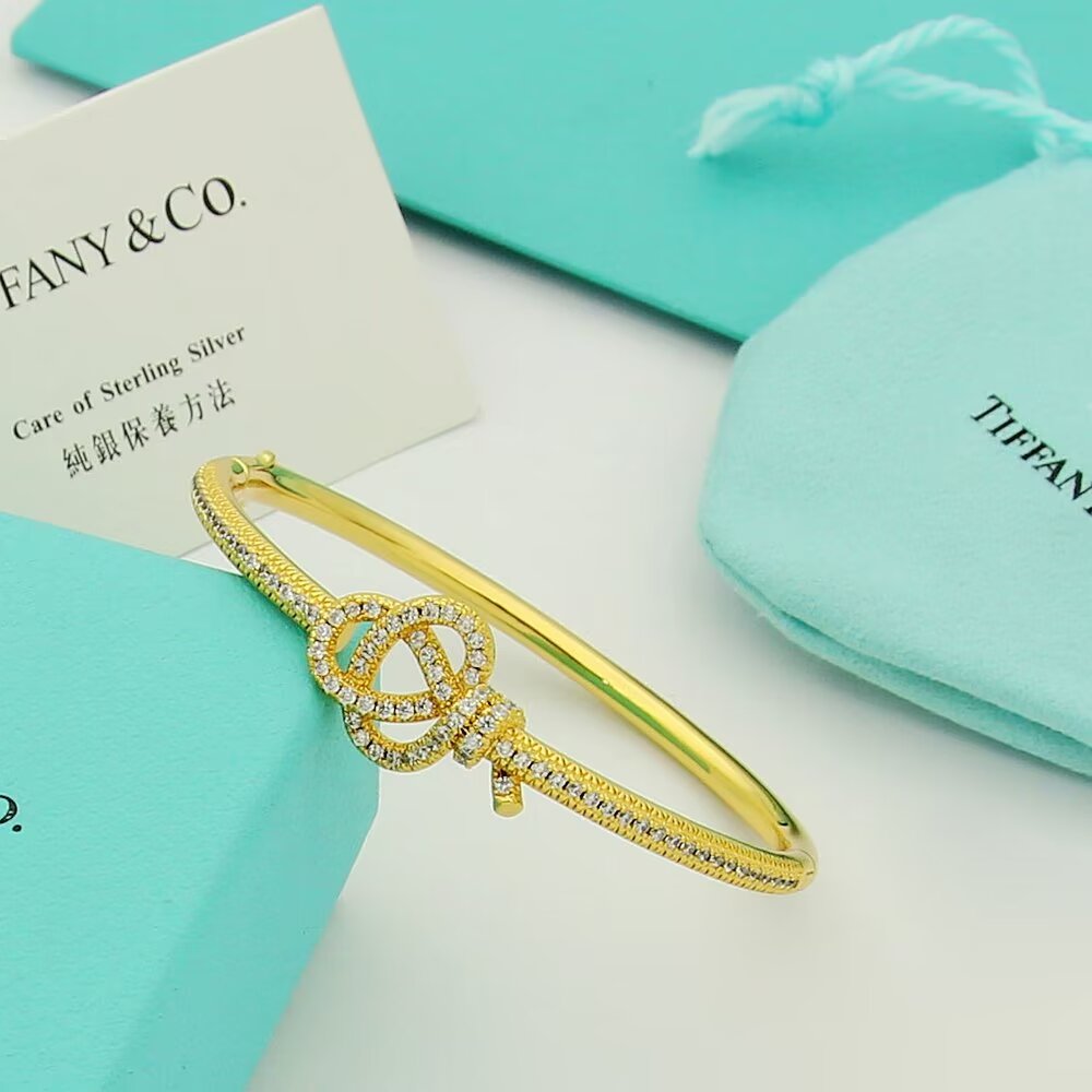 Tiffany Co Tiffany Keys Woven Key Hinged Bangle bracelet 18K yellow gold 18K rose gold 18K white gold with pave set clear diamonds 17cm inner circumference
