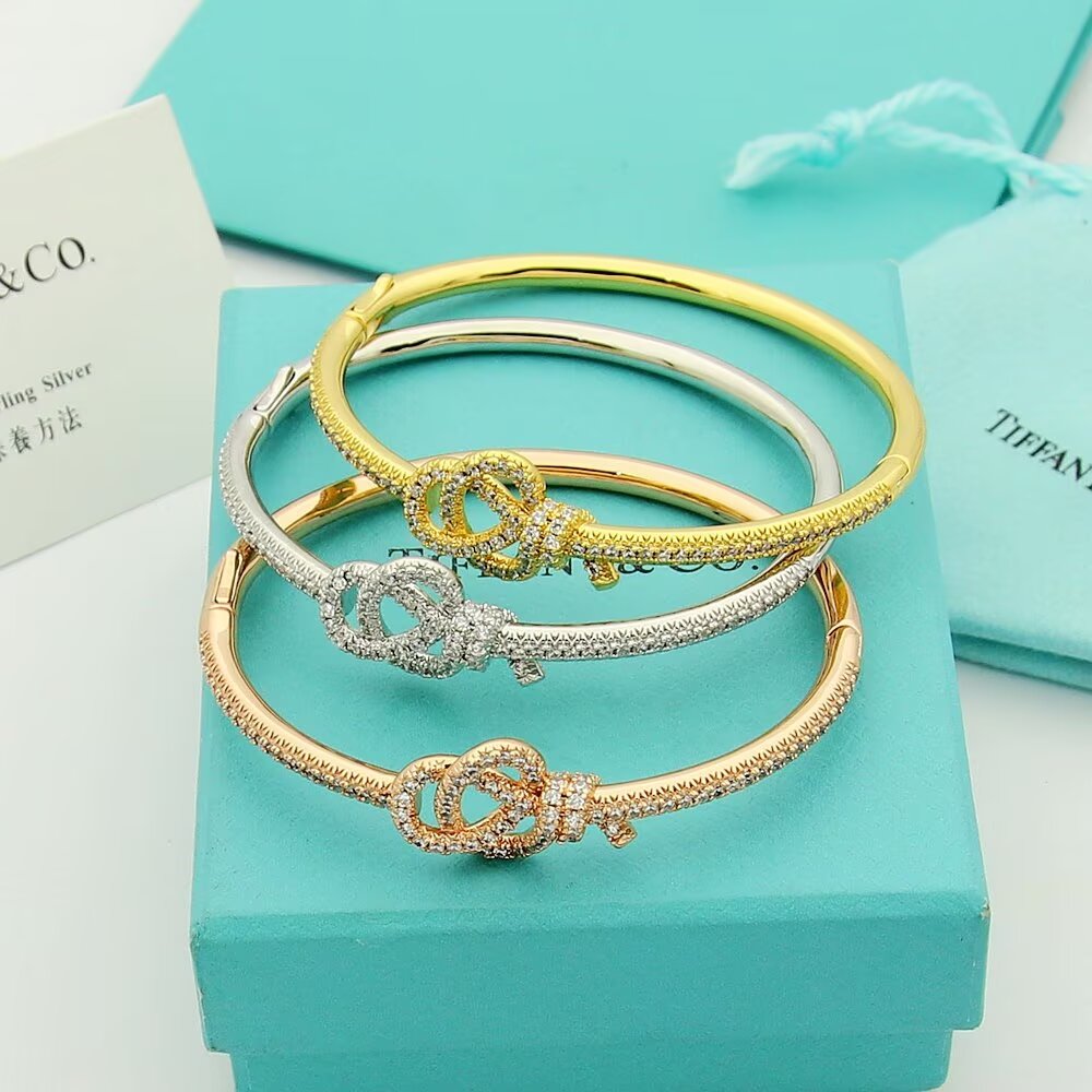 Tiffany Co Tiffany Keys Woven Key Hinged Bangle bracelet 18K yellow gold 18K rose gold 18K white gold with pave set clear diamonds 17cm inner circumference
