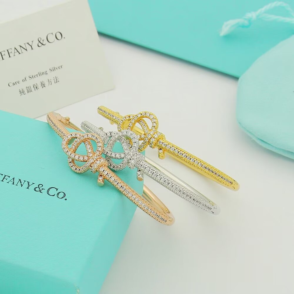 Tiffany Co Tiffany Keys Woven Key Hinged Bangle bracelet 18K yellow gold 18K rose gold 18K white gold with pave set clear diamonds 17cm inner circumference