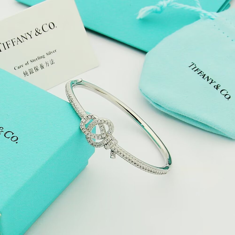 Tiffany Co Tiffany Keys Woven Key Hinged Bangle bracelet 18K yellow gold 18K rose gold 18K white gold with pave set clear diamonds 17cm inner circumference