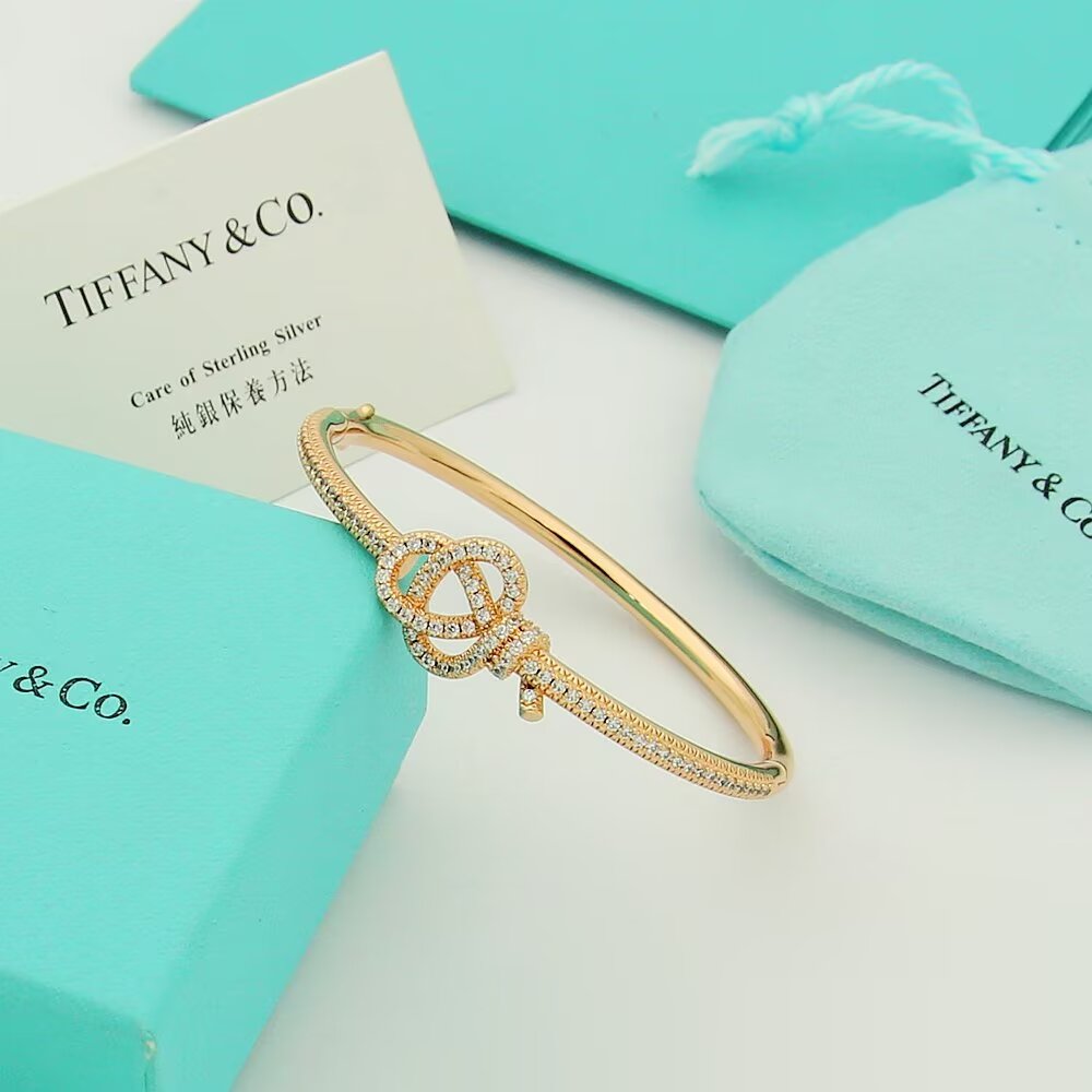 Tiffany Co Tiffany Keys Woven Key Hinged Bangle bracelet 18K yellow gold 18K rose gold 18K white gold with pave set clear diamonds 17cm inner circumference