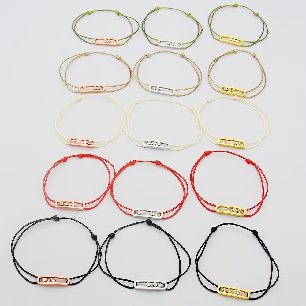 Messika Move Uno bracelet available variants 18K white gold with khaki green cord 18K white gold with black cord 18K rose gold with off-white cord 18K yellow gold with beige cord all set with clear round brilliant diamonds adjustable sliding knot cord fits 15-20cm wrist