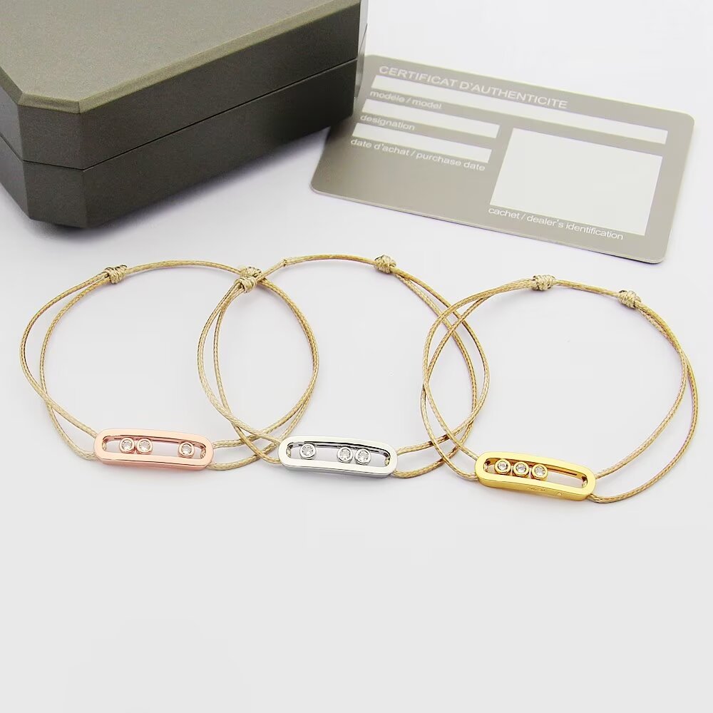 Messika Move Uno bracelet available variants 18K white gold with khaki green cord 18K white gold with black cord 18K rose gold with off-white cord 18K yellow gold with beige cord all set with clear round brilliant diamonds adjustable sliding knot cord fits 15-20cm wrist
