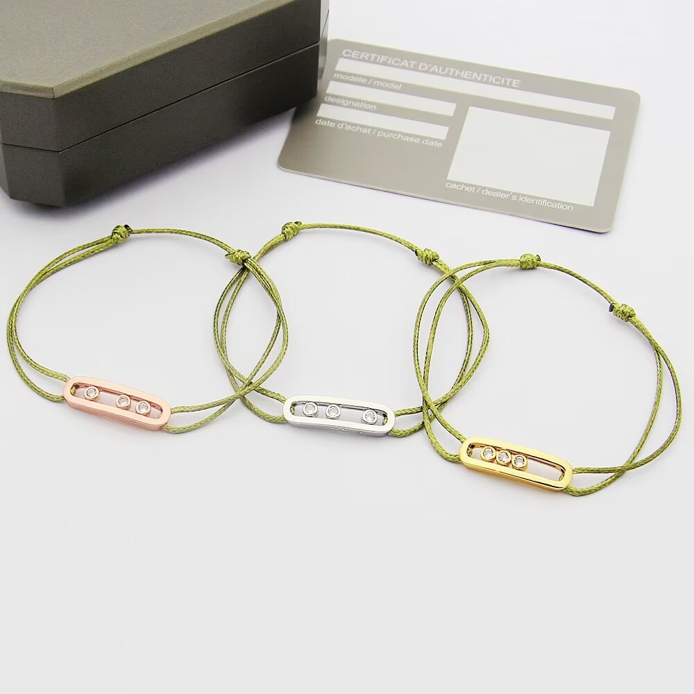 Messika Move Uno bracelet available variants 18K white gold with khaki green cord 18K white gold with black cord 18K rose gold with off-white cord 18K yellow gold with beige cord all set with clear round brilliant diamonds adjustable sliding knot cord fits 15-20cm wrist